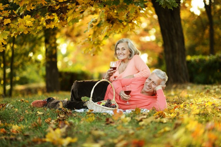 Couple in autumn park <div id="dentures"></div>